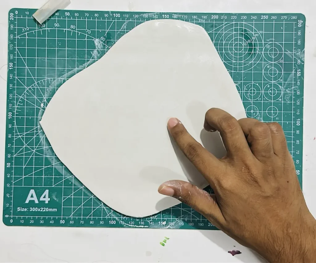 smoothing out the clay