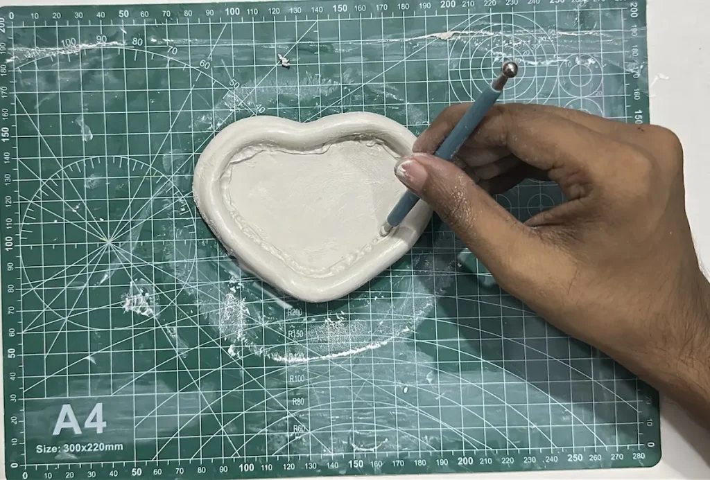 smoothing out the seam with a tool