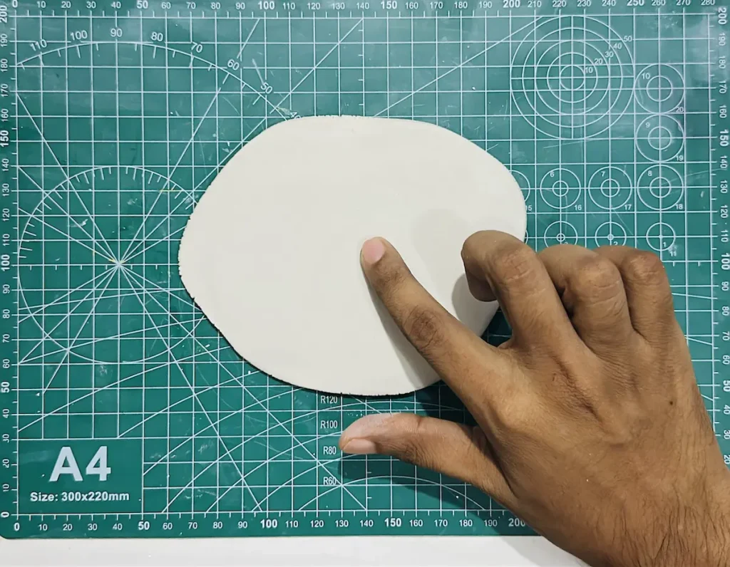 smoothing the rolled clay slab