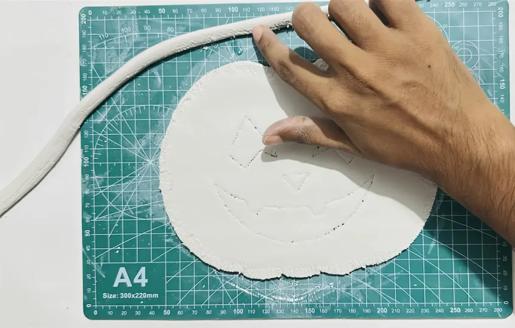 tapping the tray rim scored areas with a little bit of water